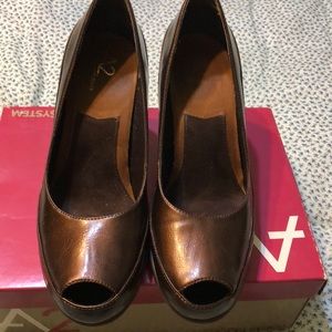 Peep toe pumps by Aerosoles